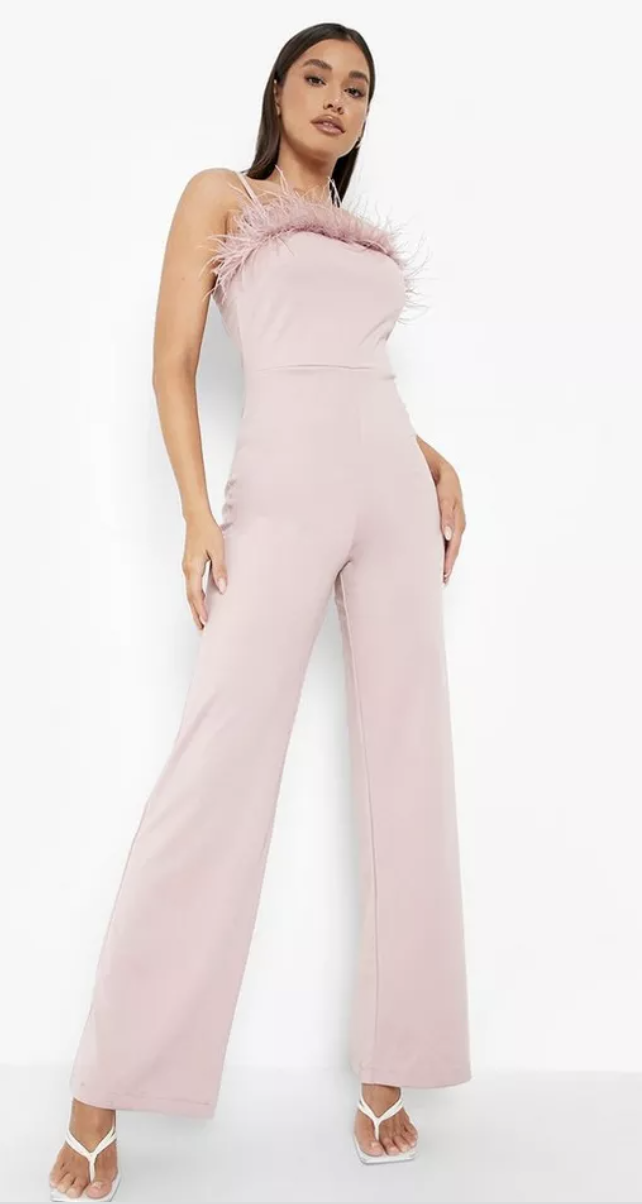 a model is shown wearing a pink Boohoo Feather Strappy Wide Leg Jumpsuit, $70 