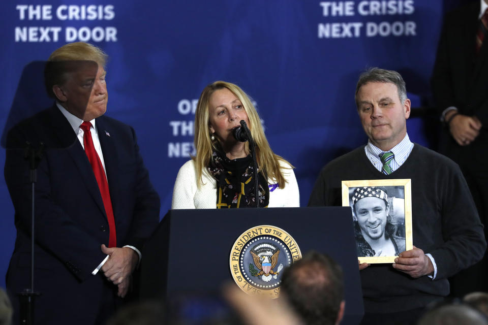 U.S. President Donald Trump listens as Jeanne Moser talks about the death of her son Adam from a fentanyl overdose as her husband Jim stands beside her with a picture of Adam during a presidential event about “combatting the opioid crisis.” (Photo: REUTERS/Jonathan Ernst)