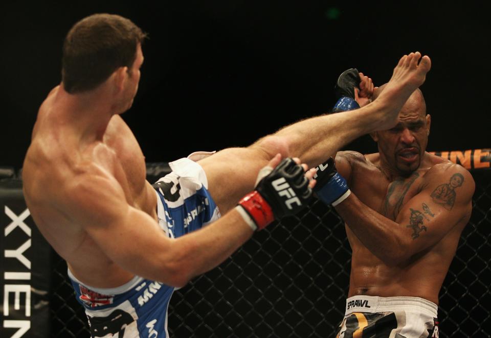 SYDNEY, AUSTRALIA - FEBRUARY 27: Michael Bisping of Great Britain kicks Jorge Rivera of the USA in their middleweight bout part of at UFC 127 at Acer Arena on February 27, 2011 in Sydney, Australia. (Photo by Mark Kolbe/Getty Images)