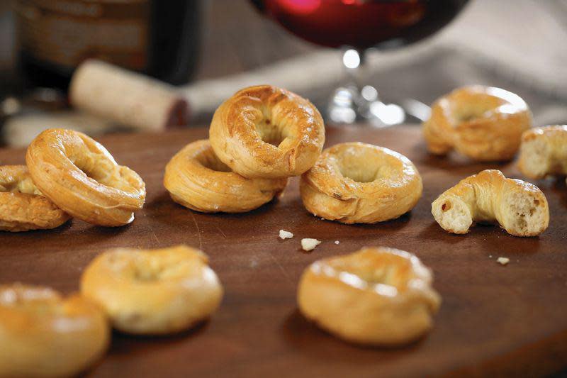 <p>Taralli is a <a href="https://www.thedailymeal.com/eat/snack-food-every-state?referrer=yahoo&category=beauty_food&include_utm=1&utm_medium=referral&utm_source=yahoo&utm_campaign=feed" rel="nofollow noopener" target="_blank" data-ylk="slk:popular snack food;elm:context_link;itc:0;sec:content-canvas" class="link ">popular snack food</a> in the southern half of the Italian peninsula. Here, the Italian pretzels are made with fennel seed and garlic. Enjoy them as-is or serve them as a side with soup and stew.</p> <p><a href="https://www.thedailymeal.com/recipe/fennel-garlic-taralli?referrer=yahoo&category=beauty_food&include_utm=1&utm_medium=referral&utm_source=yahoo&utm_campaign=feed" rel="nofollow noopener" target="_blank" data-ylk="slk:For the Fennel and Garlic Taralli recipe, click here.;elm:context_link;itc:0;sec:content-canvas" class="link ">For the Fennel and Garlic Taralli recipe, click here.</a></p>