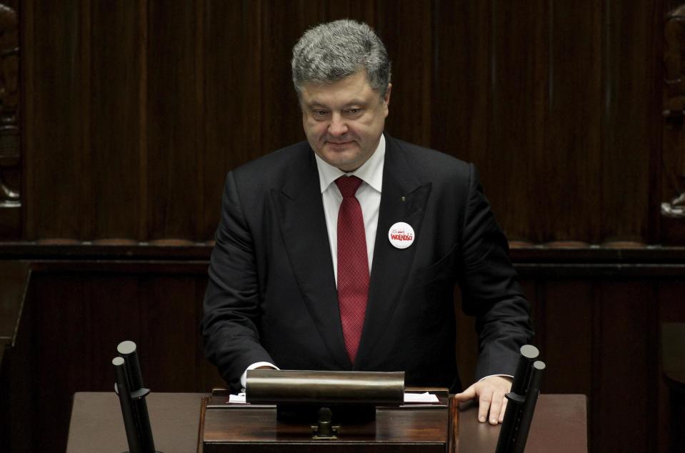 Ukrainian President Petro Poroshenko addresses the session of the Polish parliament in Warsaw, December 17, 2014. A fresh round of peace talks involving Russia, Ukraine and the Organization for Security and Cooperation in Europe may be held in the Belarussian capital on Sunday, Ukrainian President Petro Poroshenko said on Wednesday. REUTERS/Slawomir Kaminski/Agencja Gazeta (POLAND - Tags: POLITICS) ATTENTION EDITORS - THIS IMAGE HAS BEEN SUPPLIED BY A THIRD PARTY. IT IS DISTRIBUTED, EXACTLY AS RECEIVED BY REUTERS, AS A SERVICE TO CLIENTS. POLAND OUT. NO COMMERCIAL OR EDITORIAL SALES IN POLAND