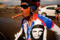 The Wider Image: Haiti's cyclists brave protests and poor roads in race for gold