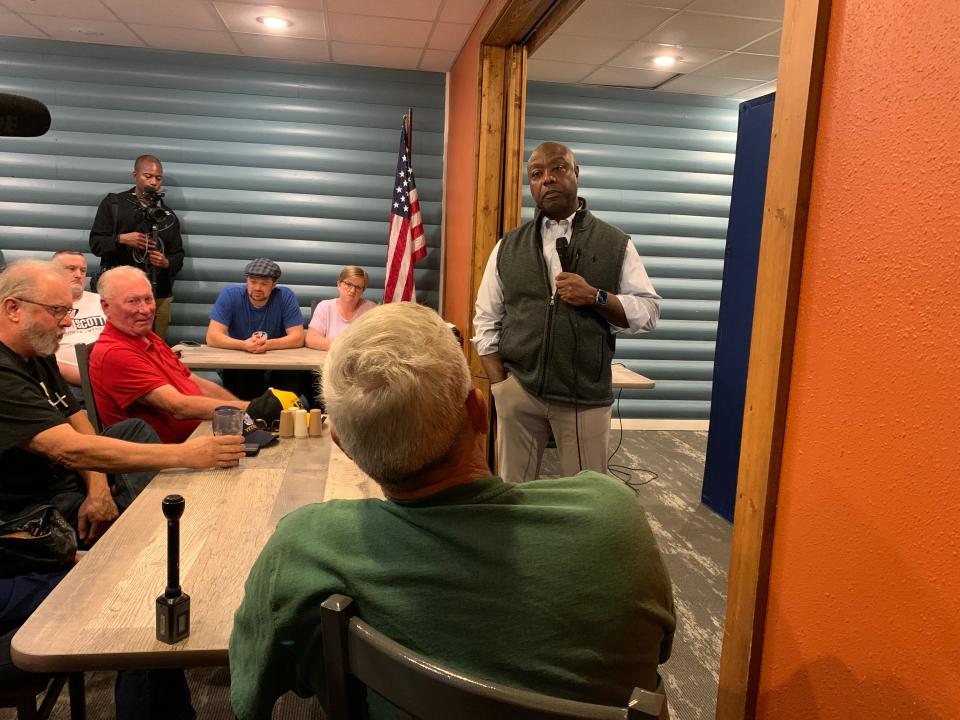 Republican presidential candidate Tim Scott listens to a question from an audience member at a meet and greet event in Creston, Iowa on Oct. 24, 2023.