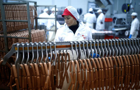 Workers work in sausages production section in Akova Impex Meat Industry Ovako, which makes halal quality certified products, in Sarajevo, Bosnia and Herzegovina, December 2, 2016. REUTERS/Dado Ruvic