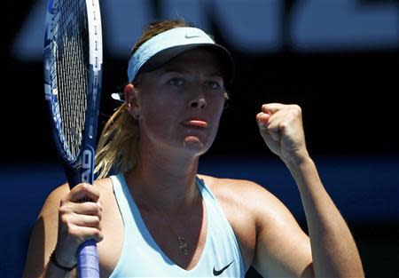 Maria Sharapova of Russia reacts during her women's singles match against Karin Knapp of Italy at the Australian Open 2014 tennis tournament in Melbourne January 16, 2014. REUTERS/David Gray