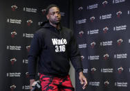 Miami Heat guard Dwyane Wade arrives for a news conference during media day at the NBA basketball team's practice facility, Monday, Sept. 24, 2018, in Miami. This will be Wade's 16th and final season in the NBA. (AP Photo/Lynne Sladky)