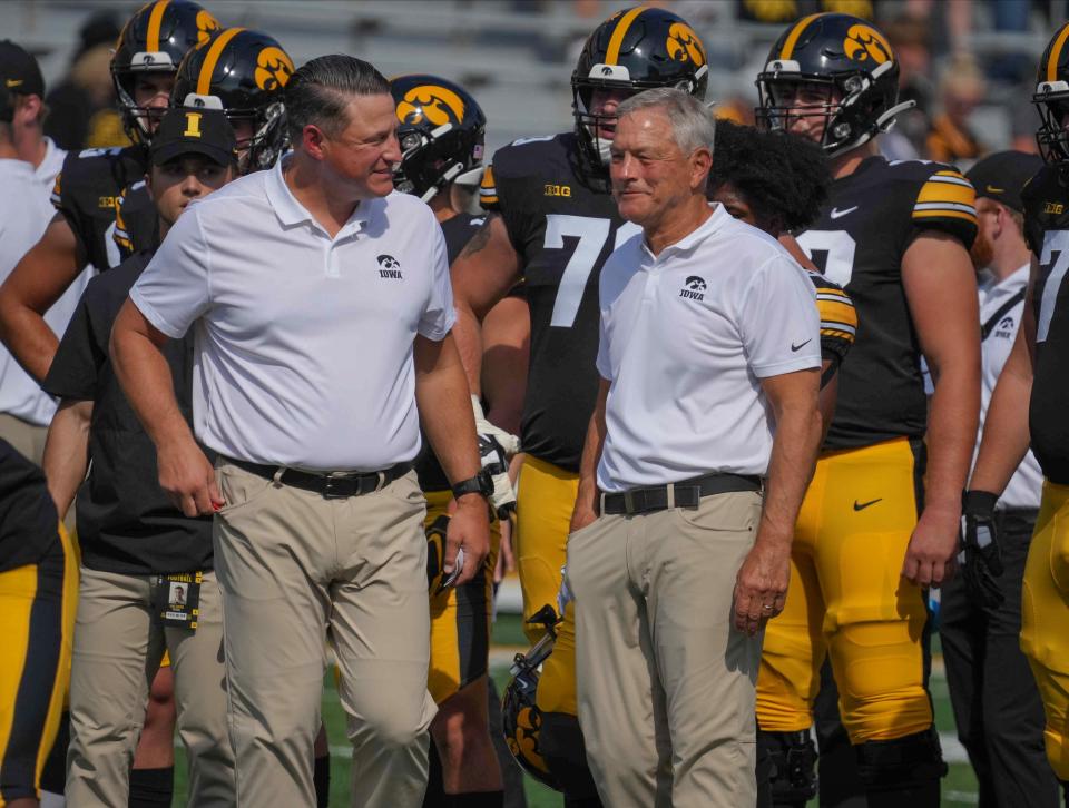 Iowa head football coach Kirk Ferentz, right, and offensive coordinator Brian Ferentz get their football team ready for kickoff against South Dakota State during a NCAA football game on Saturday, Sept. 3, 2022, at Kinnick Stadium in Iowa City.