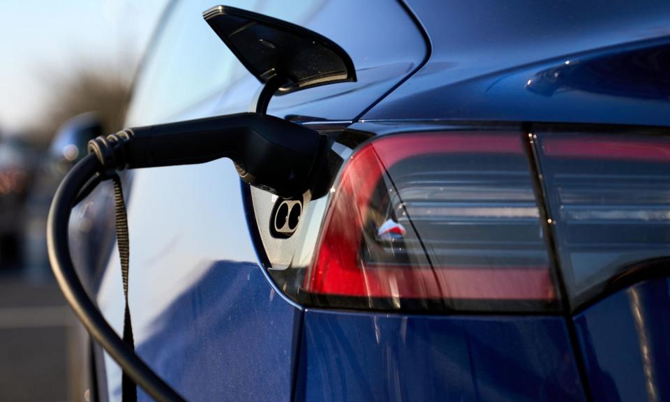 <span>The number of electric cars on UK roads is still dwarfed by those vehicles using fossil fuels.</span><span>Photograph: John Walton/PA</span>