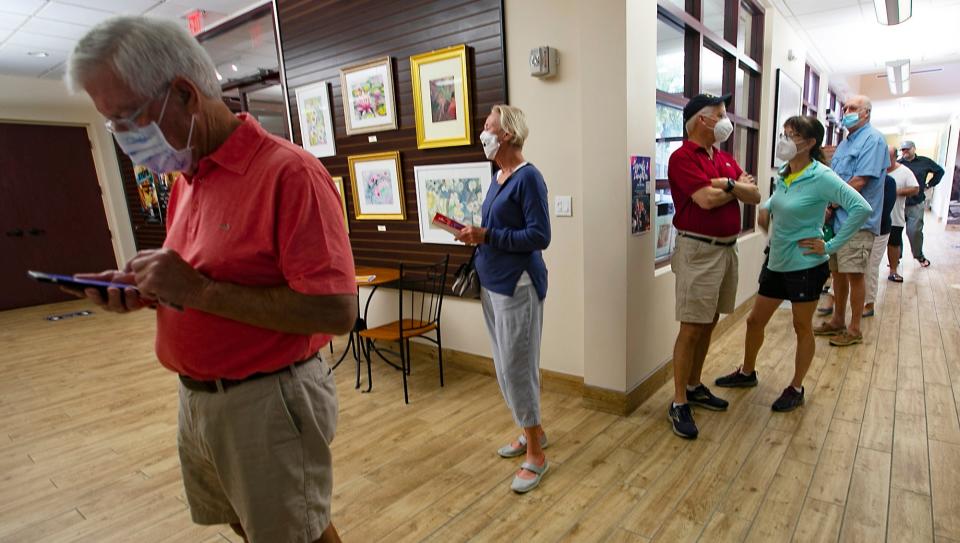 Voters lined up early to cast their ballots Wednesday, January 26, 2022 at Norris Community Center in downtown Naples. Early voting for the city began at 10 am, as residents selected city council candidates. 