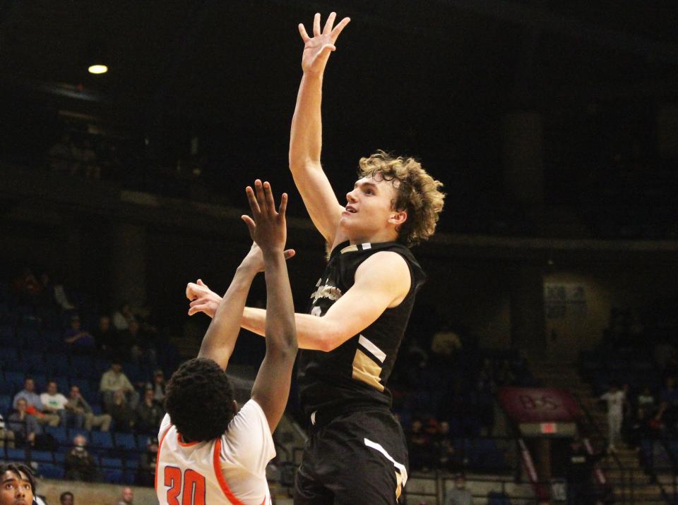 Sacred Heart-Griffin's Jake Hamilton attempts a shot against East St. Louis during the Class 3A boys basketball supersectional game at the Bank of Springfield Center on Monday, March 6, 2023.