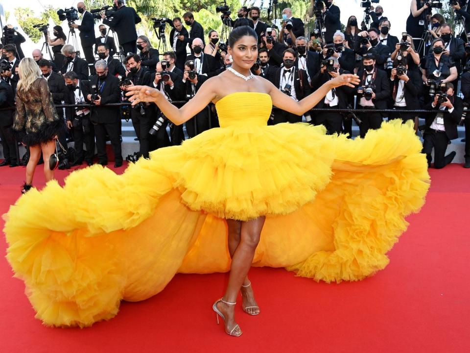 Farhana Bodi wears a strapless yellow ball gown at the 2021 Cannes Film Festival.