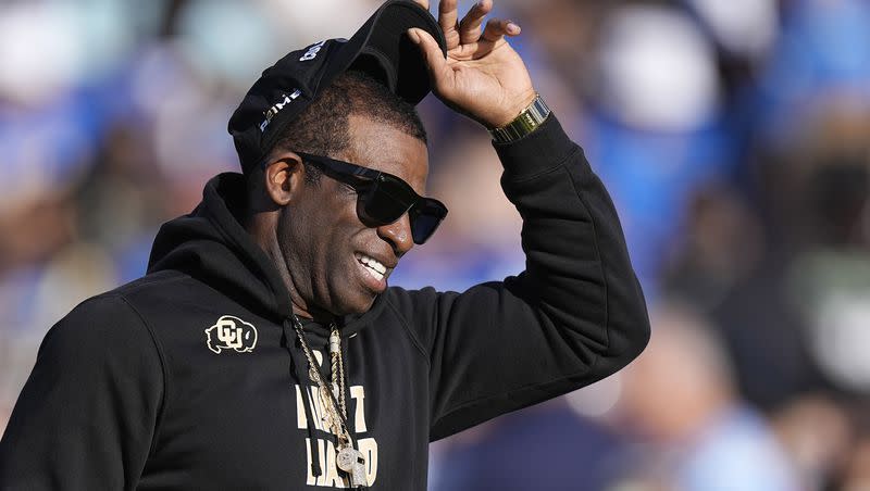 Colorado coach Deion Sanders stands on the field prior to a game against UCLA Saturday, Oct. 28, 2023, in Pasadena, Calif. Sanders will lead his Buffaloes into Rice-Eccles Stadium this Saturday.