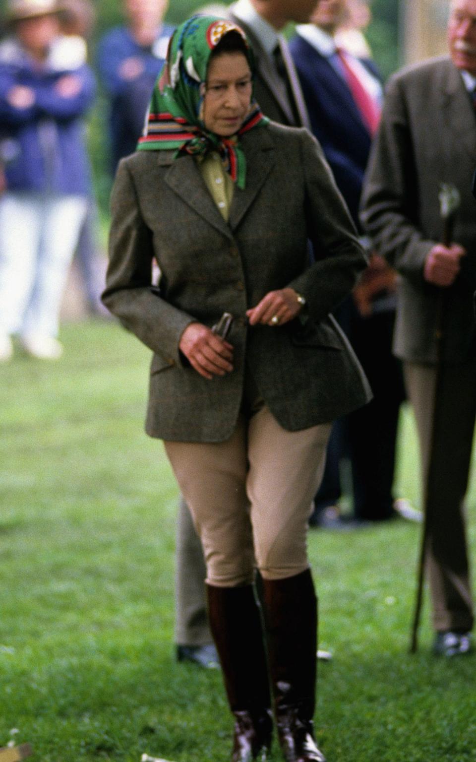 The Queen wearing one of her signature headscarves in 1988 - Hulton