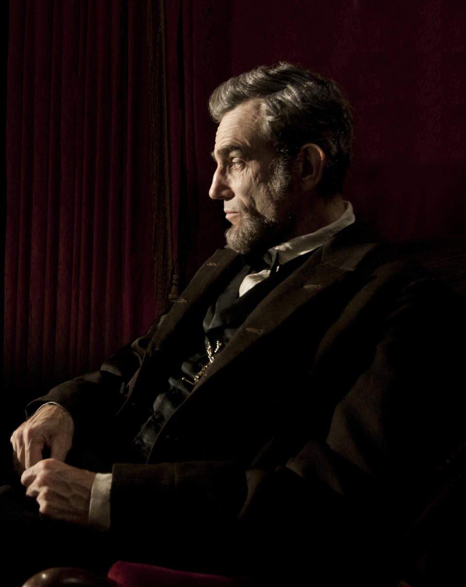 FILE - This publicity film image released by DreamWorks and Twentieth Century Fox shows Daniel Day-Lewis portraying Abraham Lincoln in the film "Lincoln." From the campaign of “Lincoln,” the Steven Spielberg-directed film backed by The Walt Disney Co., critics say they've received no less than four coffee table books, an intricately framed DVD for review purposes and even a hand-signed letter from Spielberg himself, thanking them for recognizing the film with so many nominations. (AP Photo/DreamWorks, Twentieth Century Fox, David James, file)