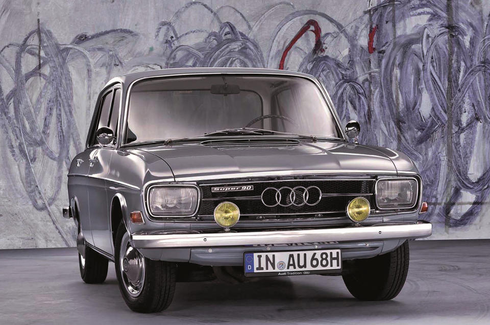 <p>After ownership of Auto Union switched from Mercedes-Benz to Volkswagen in 1964, the days of the smoky old DKW range were numbered. The front-wheel drive DKW F102 model was redesigned with four-stroke (instead of two-stroke) engines and a slow haul upmarket began with a rebrand as Audi – a name last see on a car in 1939. The Super 90 was the best of the F103 series, with a <strong>1.8-litre</strong> twin-choke carb engine giving <strong>89bhp</strong> so that it could hit <strong>100mph</strong>.</p>