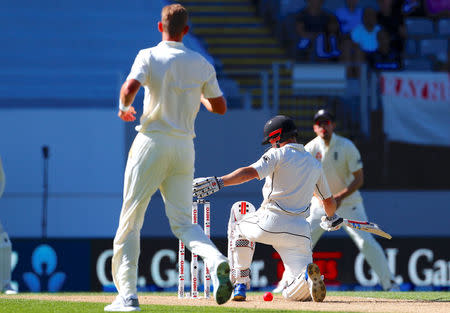 Cricket - Test Match - New Zealand v England - Eden Park, Auckland, New Zealand, March 25, 2018. New Zealand's Henry Nicholls reacts after England's Stuart Broad threw the ball at him during the fourth day of the first cricket test match. REUTERS/David Gray