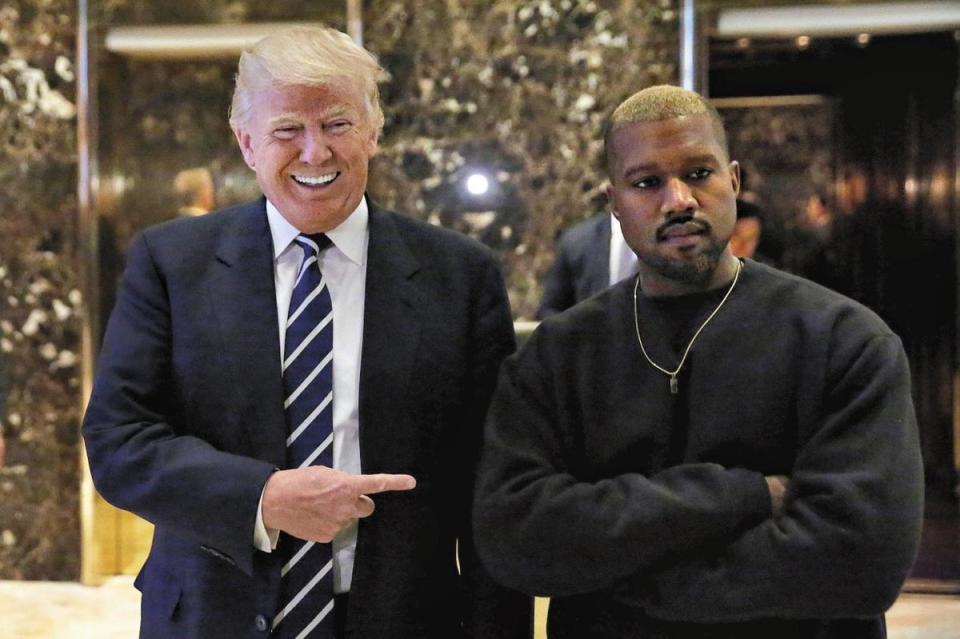 Donald Trump and musician Kanye West pose for media at Trump Tower, Manhattan in 2016 (REUTERS)