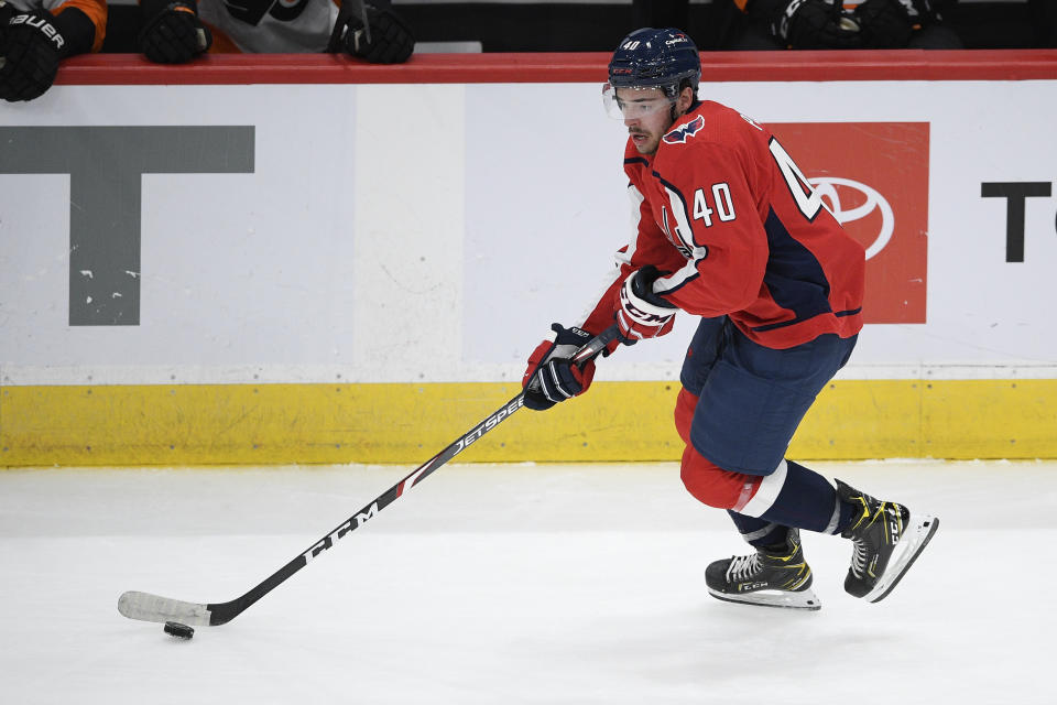 Washington Capitals center Garrett Pilon skates with the puck during the third period of the team's NHL hockey game against the Philadelphia Flyers, Saturday, May 8, 2021, in Washington. The Capitals won 2-1 in overtime. (AP Photo/Nick Wass)