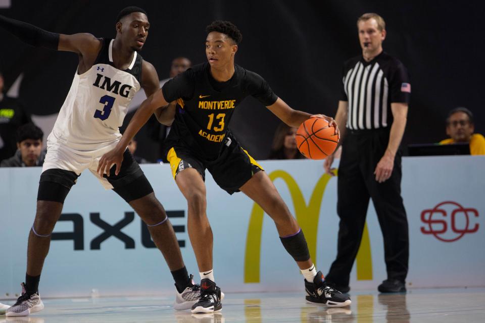 Montverde Academy's Kwame Evans Jr. (13) backs down IMG Academy's Eric Dailey Jr. (3) during the second half of the GEICO Nationals semifinal between Montverde Academy and IMG Academy, Friday, April 1, 2022, at Suncoast Credit Union Arena in Fort Myers, Fla.Montverde Academy defeated IMG Academy 62-57.