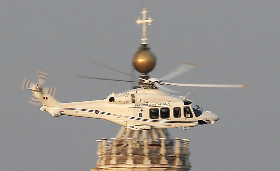 FILE - A helicopter with Pope Benedict XVI onboard leaves the Vatican to take him to the papal retreat at Castel Gandolfo south of Rome, to spend the first months of his retirement, on Feb. 28, 2013. Benedict chose Feb. 11, 2013 -- a Vatican holiday, with a routine audience with his cardinals -- to make the historic announcement in Latin that he would become the first pope since Gregory XII in 1415 to resign. Benedict, the German theologian who will be remembered as the first pope in 600 years to resign, has died, the Vatican announced Saturday Dec. 31, 2022. He was 95. (AP Photo/Michael Sohn, File)