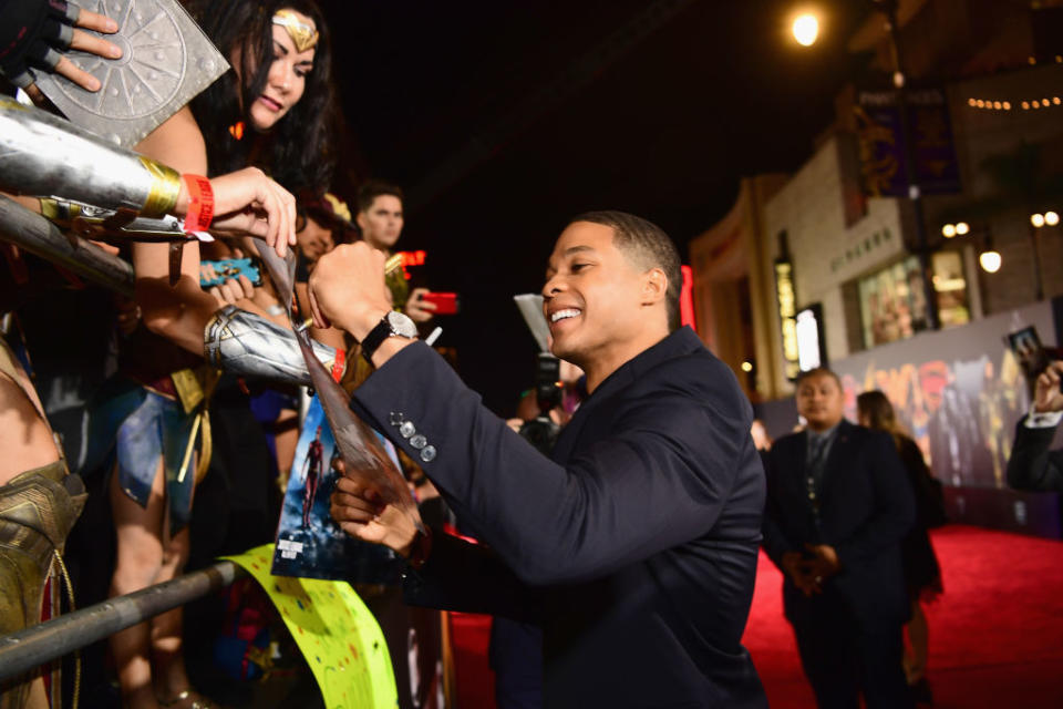 Ray Fisher signs autographs at the premiere of 