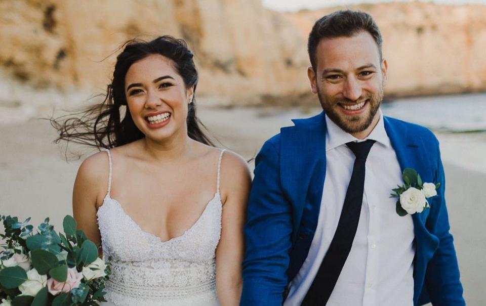 Caroline Crouch and Charalambos (Babis) Anagnostopoulos on their wedding day in Praia Do Canavial, Portugal - Athena Pictures