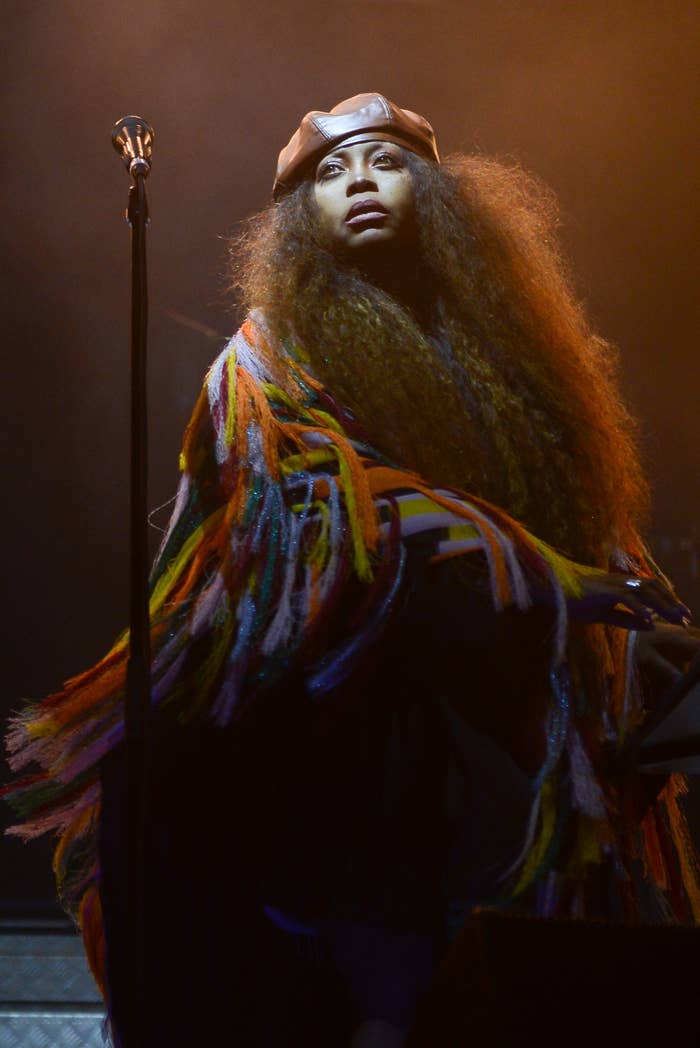 Erykah performing on stage