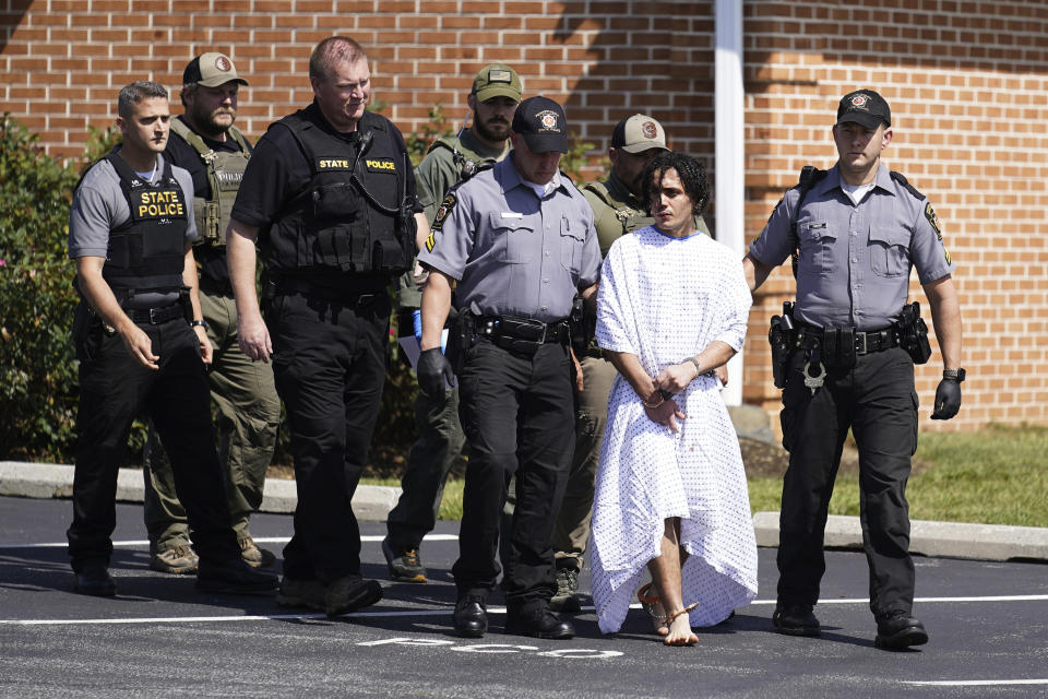 Law enforcement officers escort Danelo Cavalcante from a Pennsylvania State Police barracks in Avondale Pa., Wednesday, Sept. 13, 2023. Cavalcante was captured Wednesday after eluding hundreds of searchers for two weeks. (AP Photo/Matt Rourke)