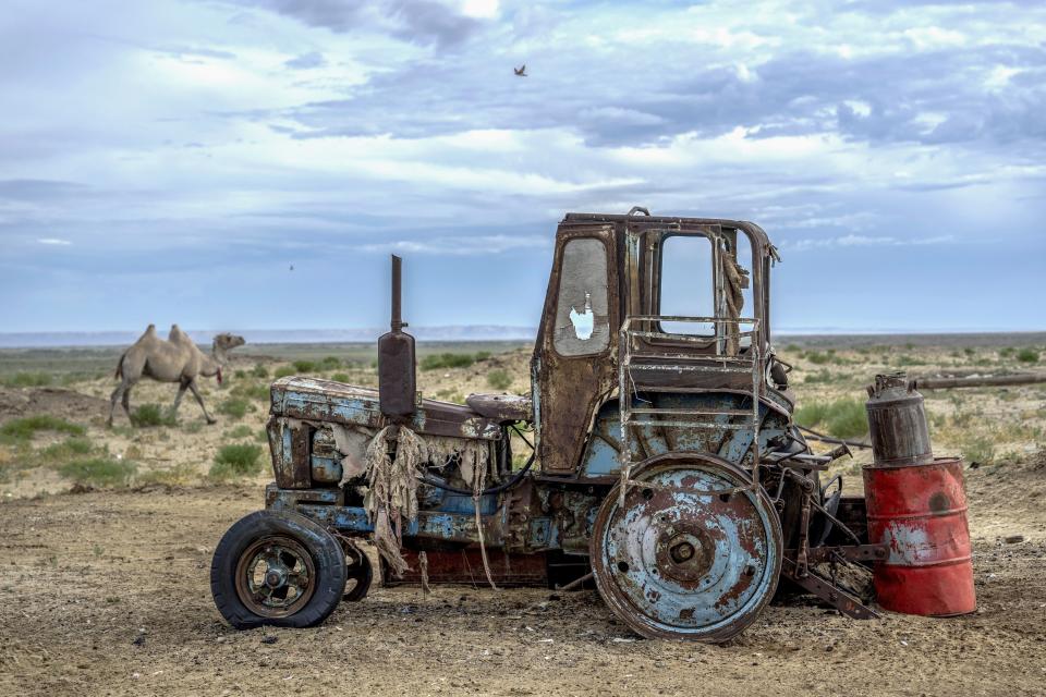 A rusted dilapidated tractor can sits along the dried-up Aral Sea, in the village of Tastubek, near Aralsk, Kazakhstan, Saturday, July 1, 2023. The demise of the once-mighty sea has affected thousands of residents and their livelihoods for decades. (AP Photo/Ebrahim Noroozi)