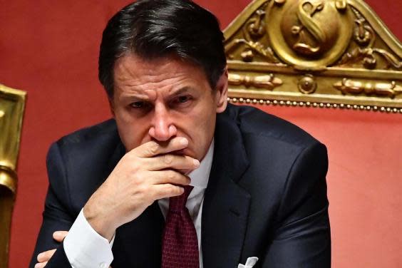 Giuseppe Conte looks on after he addressed the Senate in Rome (EPA)
