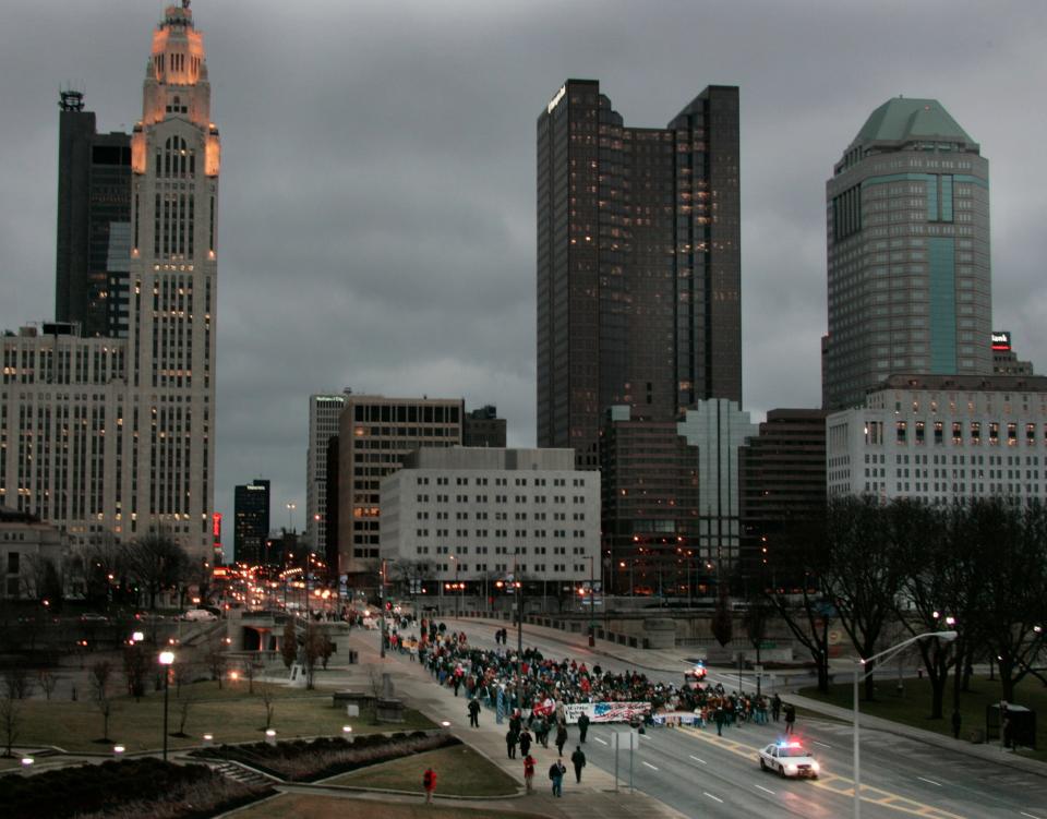 Participants in the Martin Luther King Day March in 2007 walking west across the Broad St bridge from Columbus City Hall to Veteran's Memorial.