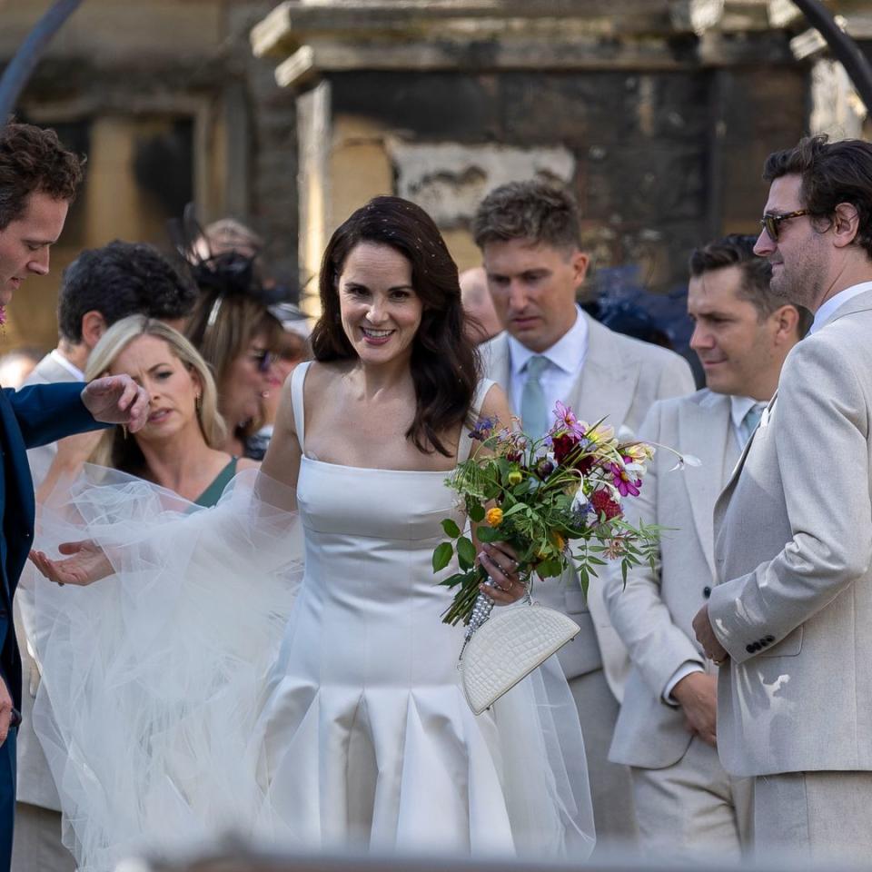 Downton Abbey's Michelle Dockery's on-screen sister Laura Carmichael is radiant as her bridesmaid