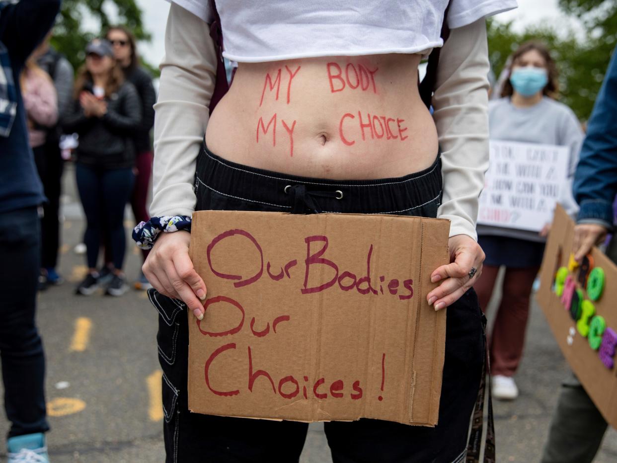 Abortion-rights protesters hold signs during a demonstration outside of the U.S. Supreme Court in Washington, Sunday, May 8, 2022. (AP Photo/Amanda Andrade-Rhoades)