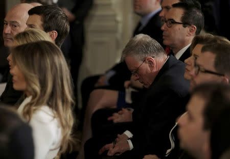 Acting U.S. National Security Advisor Retired General Keith Kellogg takes notes as he sits between first lady Melania Trump (L) and Treasury Secretary Steven Mnuchin (R-rear) during a joint news conference between U.S. President Donald Trump and Israeli Prime Minister Benjamin Netanyahu at the White House in Washington, U.S., February 15, 2017. REUTERS/Carlos Barria