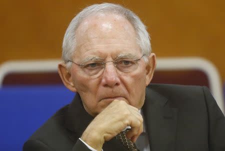 German Finance Minister Wolfgang Schaeuble listens during a talk with his Vietnamese counterpart Dinh Tien Dung (unseen) at the Finance Ministry in Hanoi September 22, 2014. REUTERS/Kham