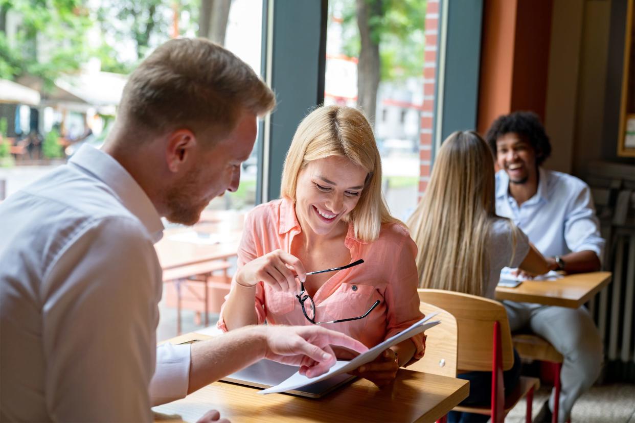 Couple looking at menu in restaurant