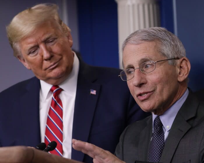 WASHINGTON, DC - MARCH 20: U.S. President Donald Trump listens to Dr. Anthony Fauci, director of the National Institute of Allergy and Infectious Diseases, during a Corona Task Force briefing on the latest development of the coronavirus outbreak in the U.S. in the James Brady Press Briefing Room at the White House March 20, 2020 in Washington, DC. With deaths caused by the coronavirus rising and foreseeable economic turmoil, the Senate is working on legislation for a $1 trillion aid package to deal with the COVID-19 pandemic. President Trump announced that tax day will be delayed from April 15 to July 15. (Photo by Alex Wong/Getty Images)