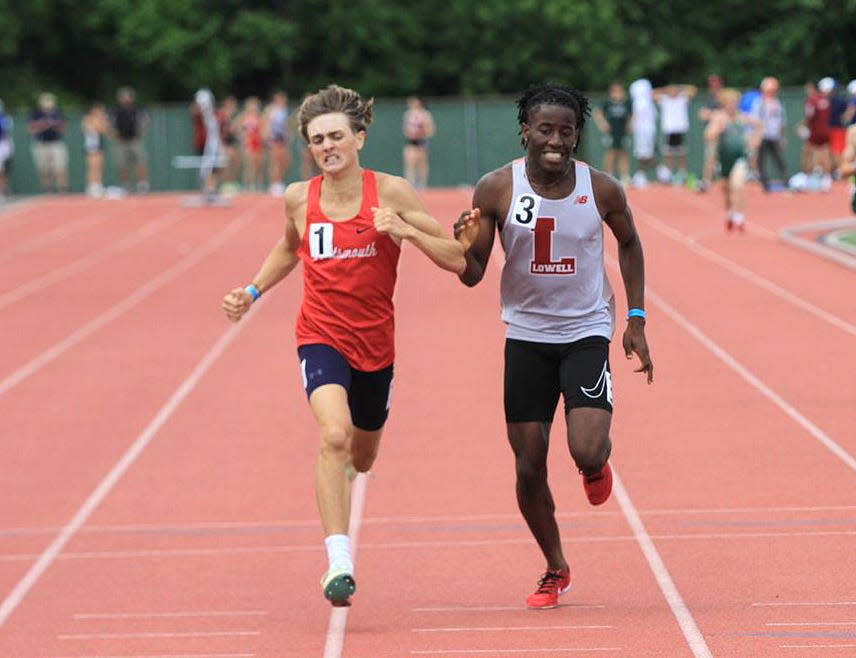 Portsmouth graduate Kaden Kluth, left, battles David Vandi of Lowell, Mass., down the stretch of the 800 meters at the New England track and field championship meet. Kluth won by less than a second.