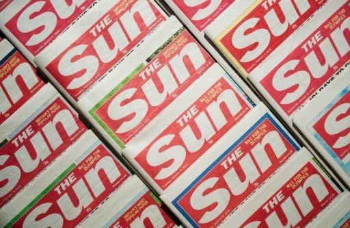 An arrangement of copies of The Sun newspaper front pages, pictured in February. Rupert Murdoch has stepped down as director of a number of companies behind British newspapers The Sun, The Times and The Sunday Times, a News International spokeswoman said on Saturday