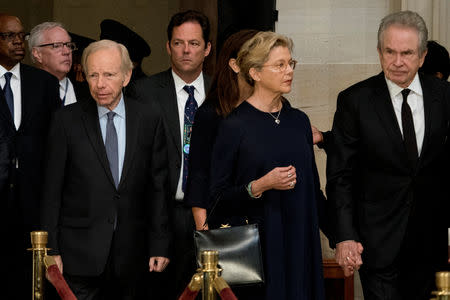 Former Connecticut Senator Joe Lieberman, left, and actors Warren Beatty, right, and his wife Annette Bening, second from right, arrive in the Rotunda before the casket of U.S. Senator John McCain, lies in state at the U.S. Capitol in Washington, U.S., August 31, 2018. Andrew Harnik/Pool via REUTERS