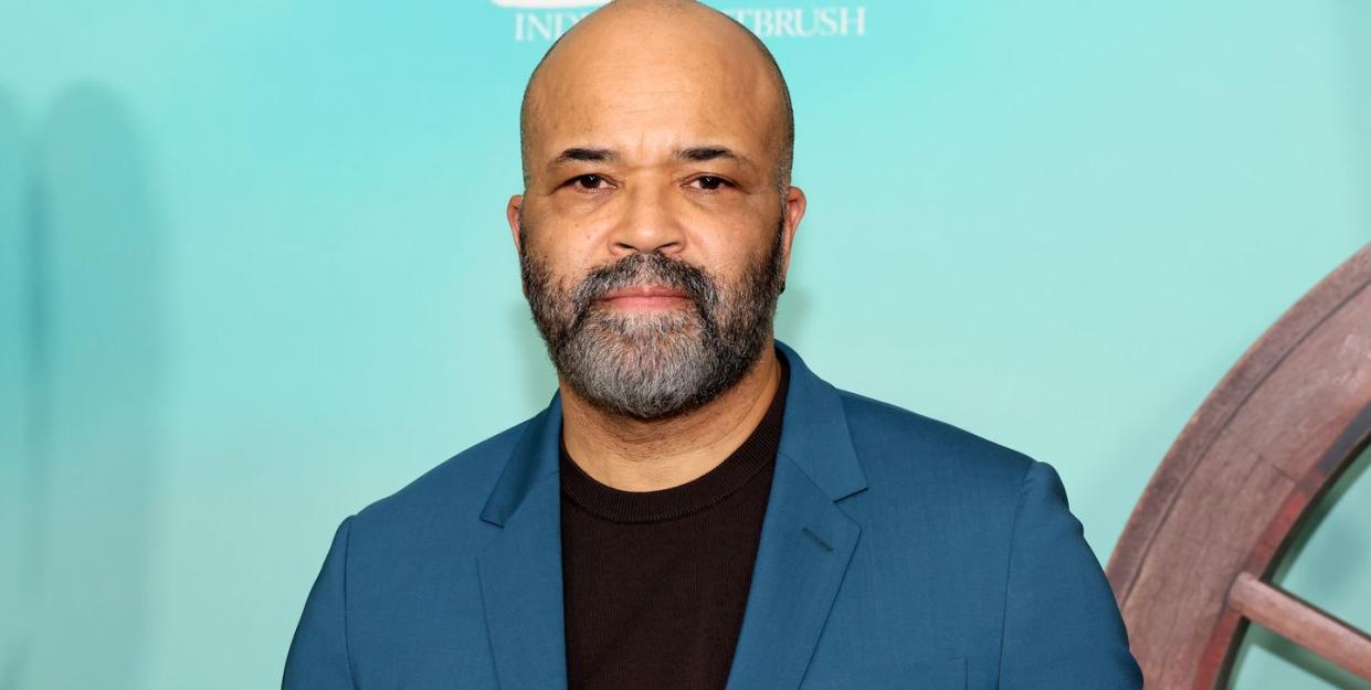 jeffrey wright attends the asteroid city premiere wearing a dark teal jacket and a black top