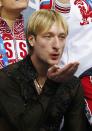 Evgeni Plushenko of Russia's figure skating team celebrates in the "kiss and cry" area during the Team Men Free Skating Program at the Sochi 2014 Winter Olympics, February 9, 2014. REUTERS/Lucy Nicholson