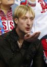 Evgeny Plyushchenko of Russia's figure skating team celebrates in the "kiss and cry" area during the Team Men Free Skating Program at the Sochi 2014 Winter Olympics, February 9, 2014. REUTERS/Lucy Nicholson (RUSSIA - Tags: SPORT FIGURE SKATING SPORT OLYMPICS)