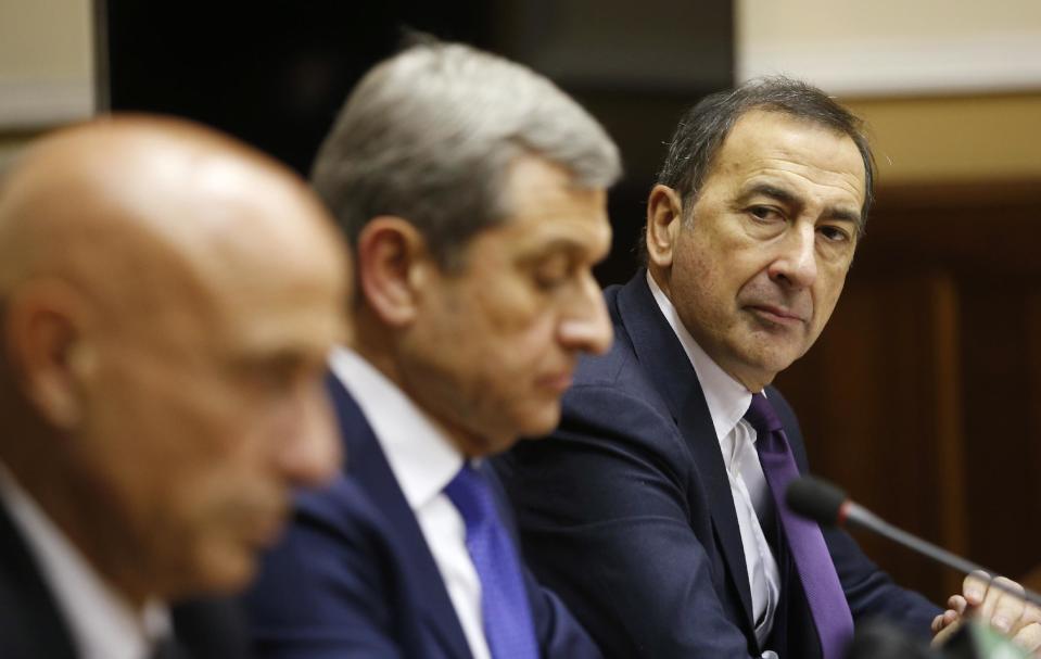 Milan's Mayor Giuseppe Sala, right, attends at a press conference after a security meeting in Milan, Italy, Thursday, Dec. 29, 2016. Italian investigators are trying to determine whether Anis Amri was tapping a jihadi network in Italy, his port of entry in early 2011 during Arab Spring, and the end of his nearly four-day flight following the truck attack on a Berlin holiday market that left 12 dead. (AP Photo/Antonio Calanni)