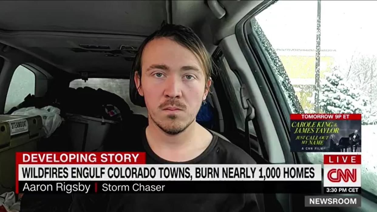 Man sitting in car being interviewed on CNN with chyron in front of kind of
