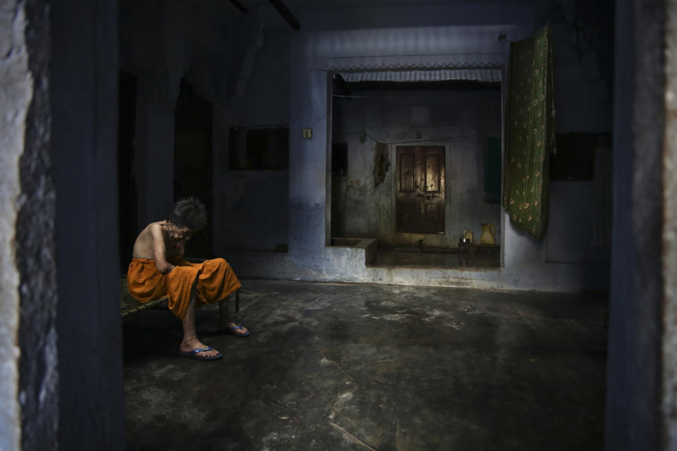 An elderly Hindu woman sits in solitude inside an ashram meant for those who come to die and attain salvation in Varanasi, one of Hinduism's holiest cities on the banks of river Ganges, in the northern Indian state of Uttar Pradesh, Friday, Oct. 18, 2019. For millions of Hindus, Varanasi is a place of pilgrimage and anyone who dies in the city or is cremated on its ghats is believed to attain salvation and freed from the cycle of birth and death. This has, for ages, motivated devout Hindus to make the pilgrimage to Varanasi in their final days. (AP Photo/Altaf Qadri)