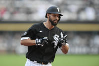 Chicago White Sox's Seby Zavala celebrates while rounding third after hitting a grand slam during the fourth inning of the team's baseball game against the Cleveland Indians on Saturday, July 31, 2021, in Chicago. (AP Photo/Paul Beaty)