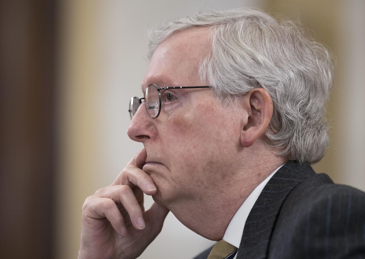 In this file photo Senate Minority Leader Mitch McConnell, R-Ky., listens at a  Senate Rules Committee hearing.