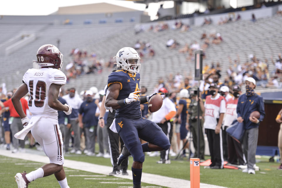 West Virginia running back Leddie Brown (4) rushes in for a touchdown against Eastern Kentucky during an NCAA college football game on Saturday, Sept. 12, 2020, in Morgantown, W.Va. (William Wotring/The Dominion-Post via AP)