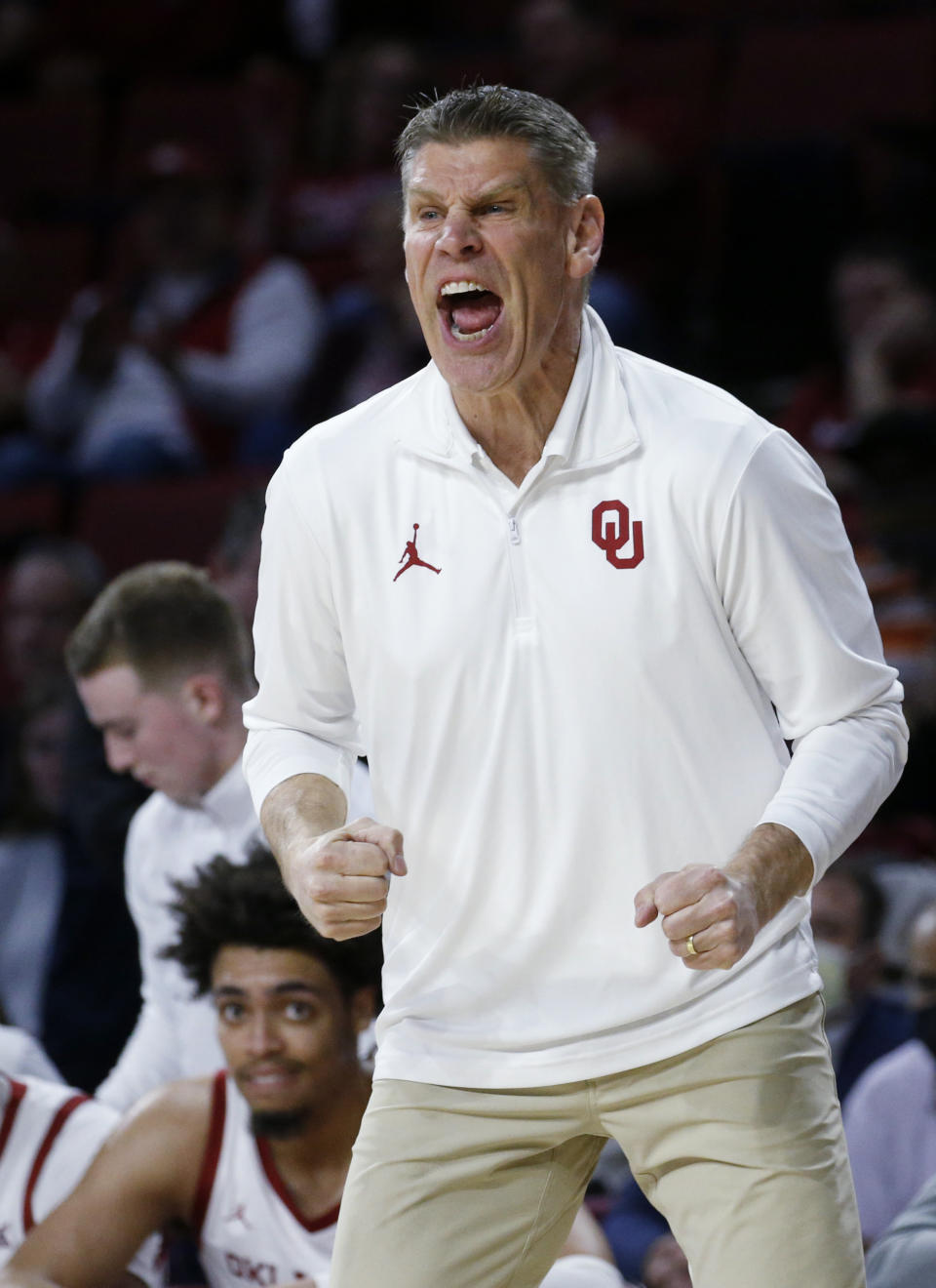 Oklahoma coach Porter Moser yells during the first half of the team's NCAA college basketball game against Texas Tech on Wednesday, Feb. 9, 2022, in Norman, Okla. (AP Photo/Garett Fisbeck)
